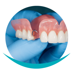 Crestview dentist holding partial dentures