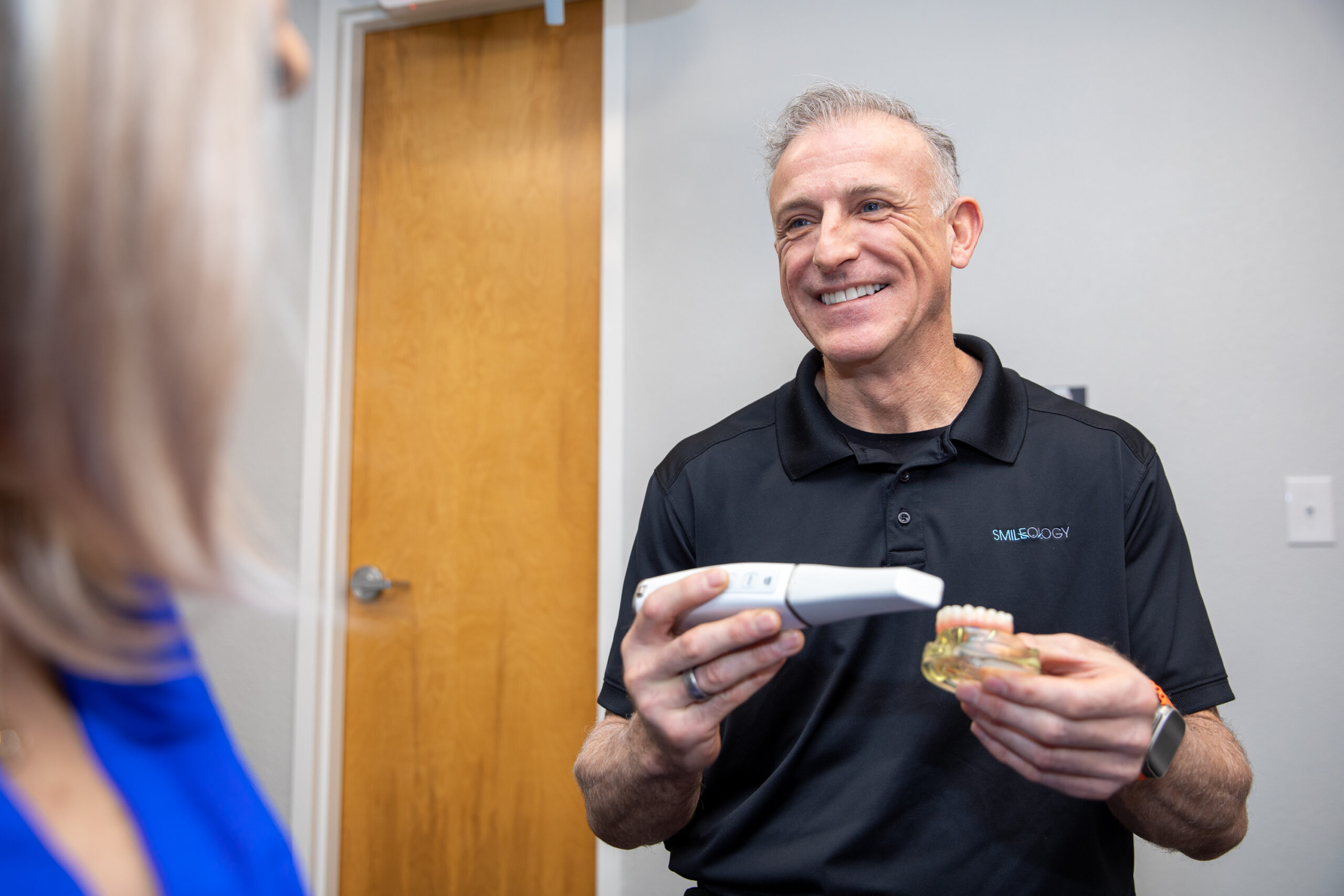 Niceville dentist Dr. Olivier Broutin with a patient