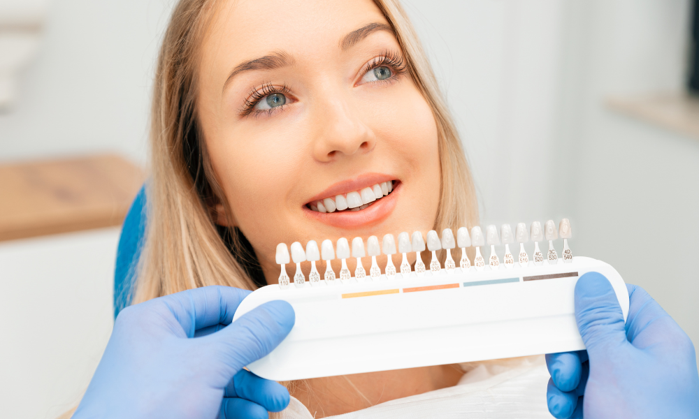 dentist applying dental veneer on patient teeth cosmetic dentistry miramar beach fl